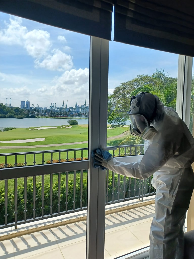 the guy is deep cleaning the window frame