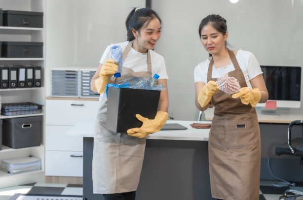 two cleaners discussing